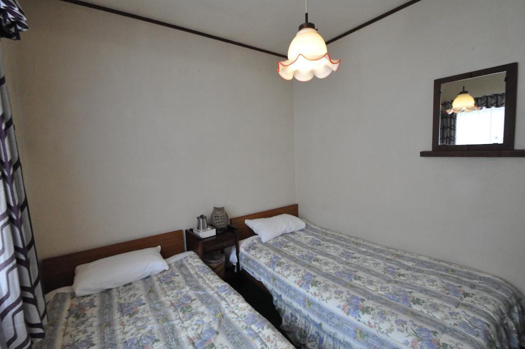 Guest House Wind Inn Hakuba Rum bild